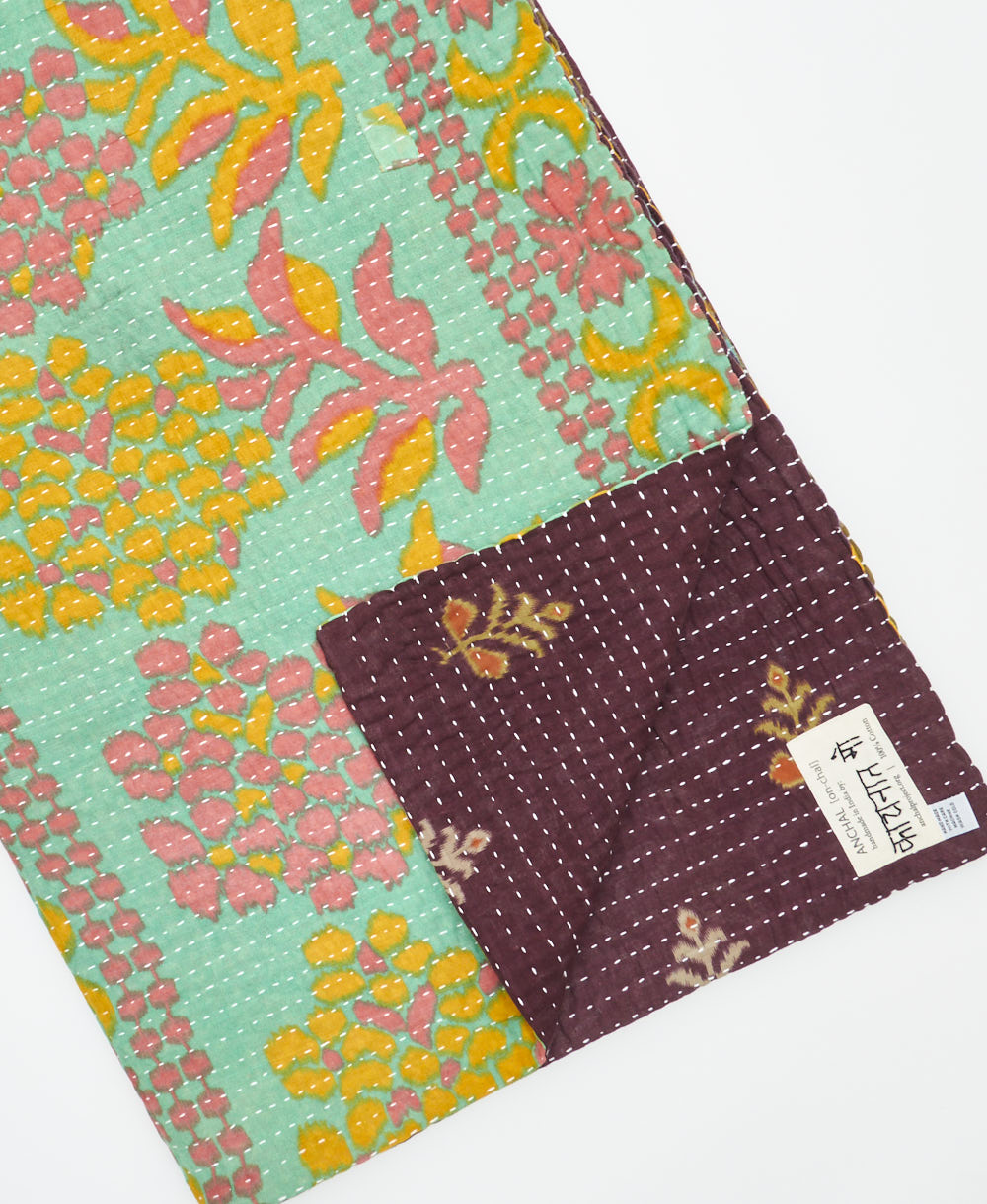 Kantha quilt throw featuring traditional kantha hand stitching