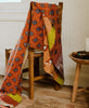 vintage kantha quilt throw draped over a chair 