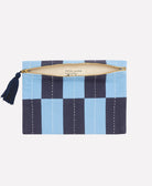 sky blue and navy blue canvas lined pouch with navy blue tassel and artisan signature on product tag