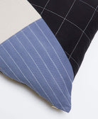 close up of medium naari colorblock throw pillow with white hand-stitched embroidery