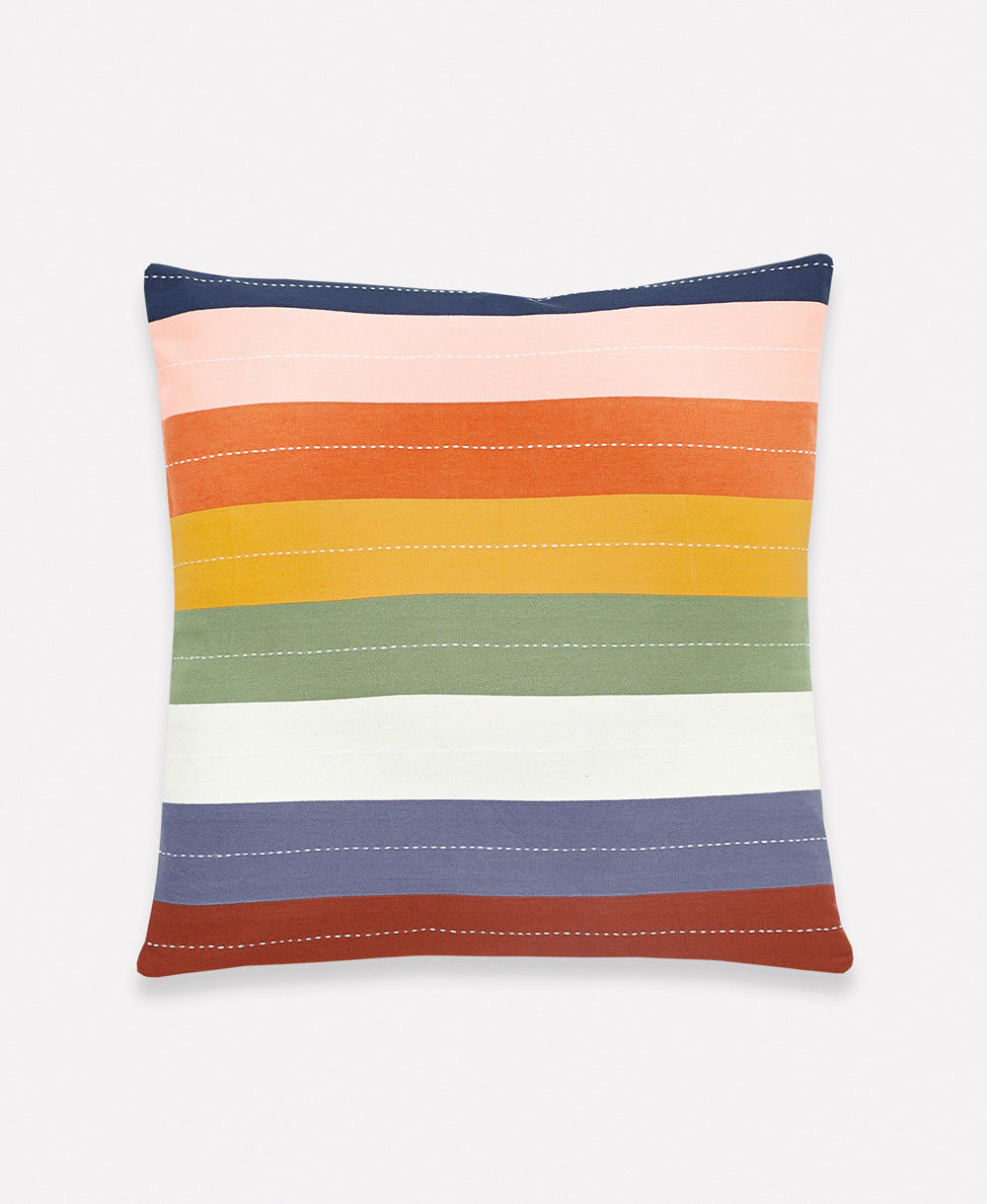 rainbow striped pillow made from 100% organic cotton with white hand-stitched embroidery