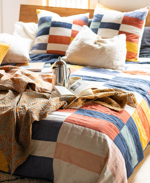 dreamy colorful bedroom with bold checkered organic cotton quilt by Anchal