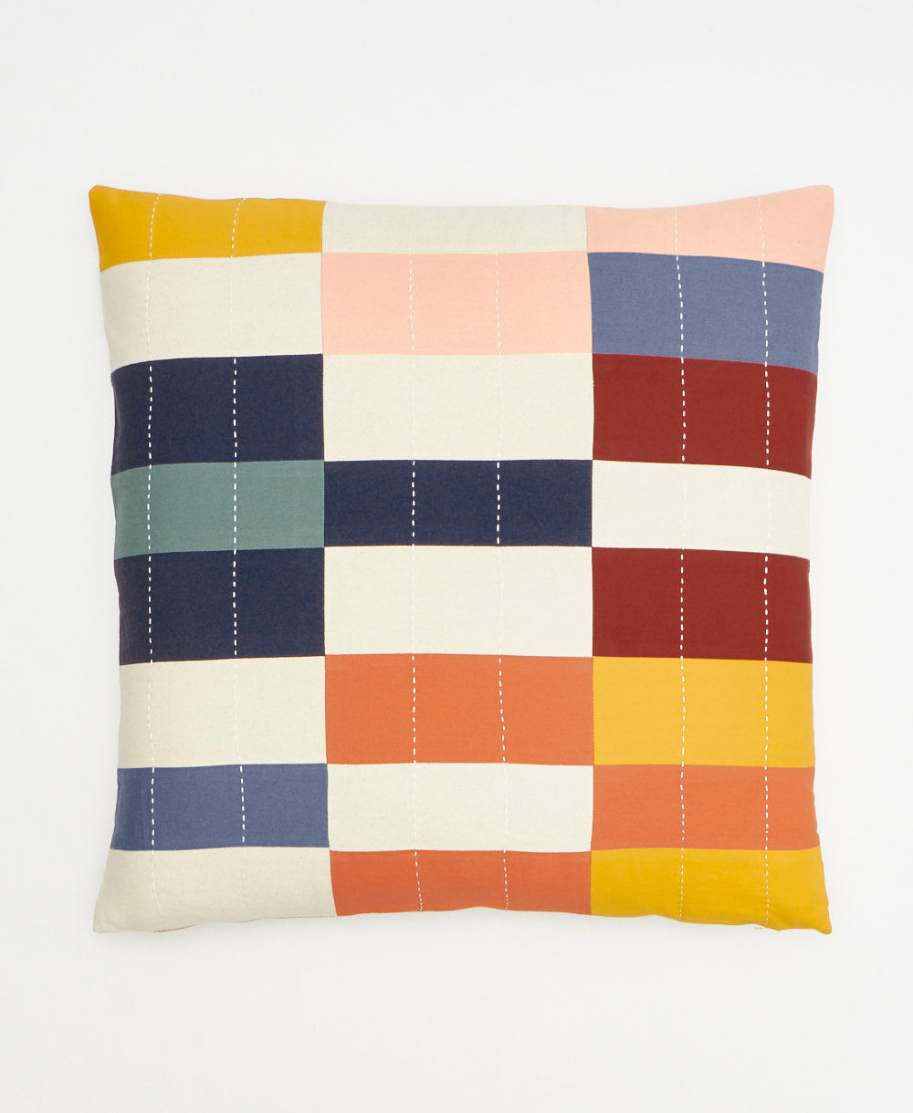 Multicolored checkered pillow on a white background