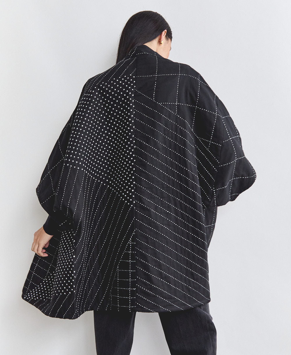 back of naari cocoon quilted jacket in charcoal black handmade in India from 100% organic cotton