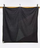 solid black back of naari patchwork quilt with white kantha embroidery
