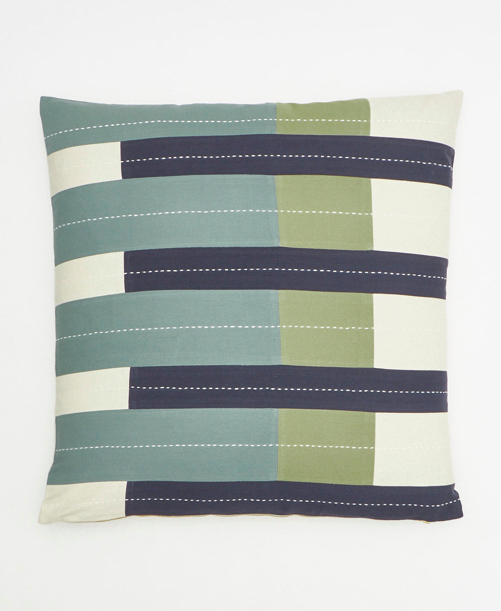 Striped pillow with green, blue, and beige colors on a white background