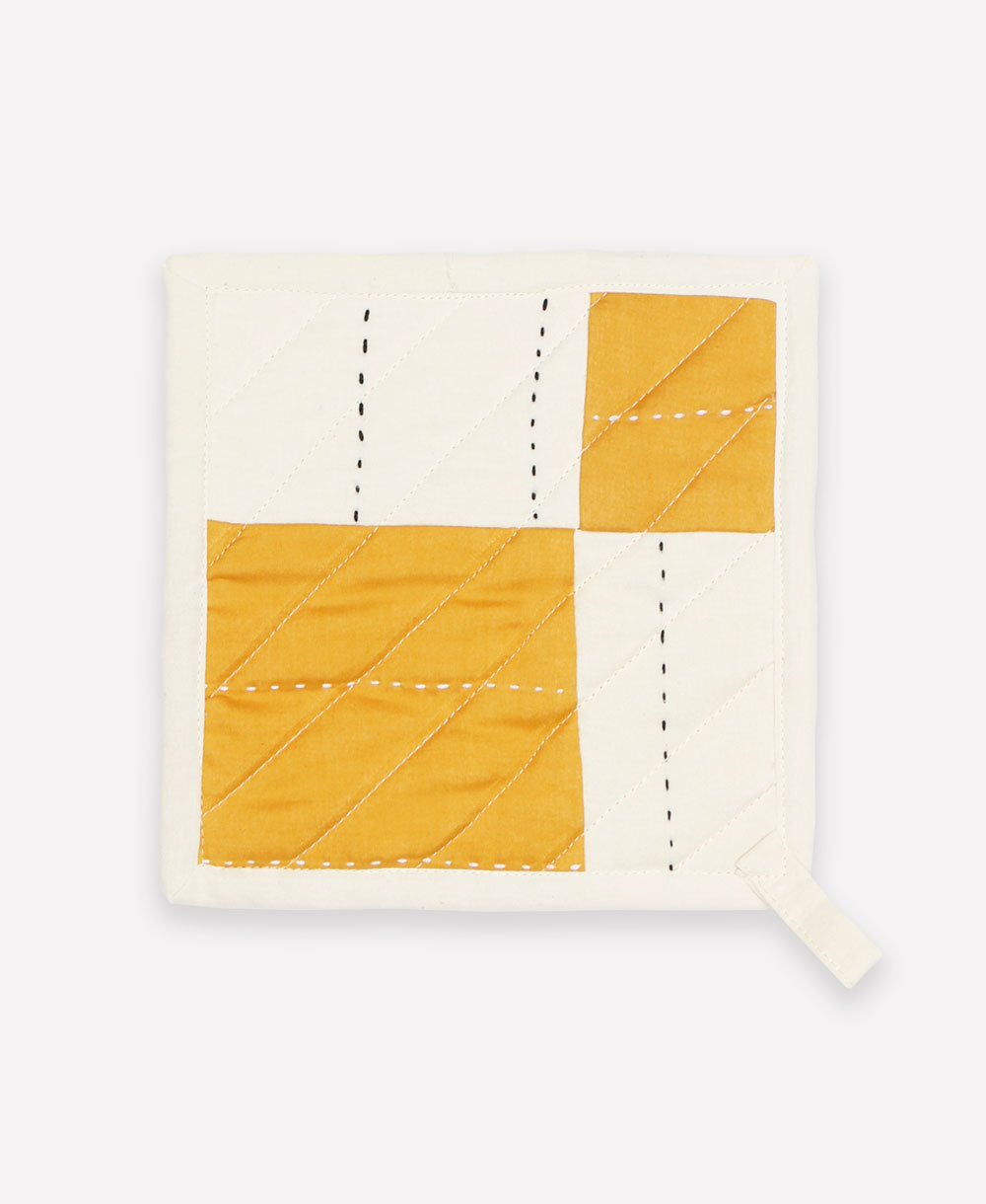 mustard yellow and white pot holder with various embroidery patterns