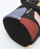 petal canvas duffle bag in a barrel shape with two exterior pockets