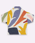 white quilted jacket in cocoon silhouette with colorful applique petals and short sleeves