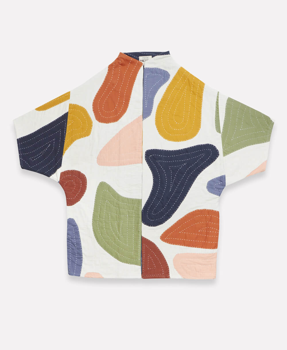 quilted cocoon jacket in white with colorful organic shaped applique handmade in India with hidden side pockets