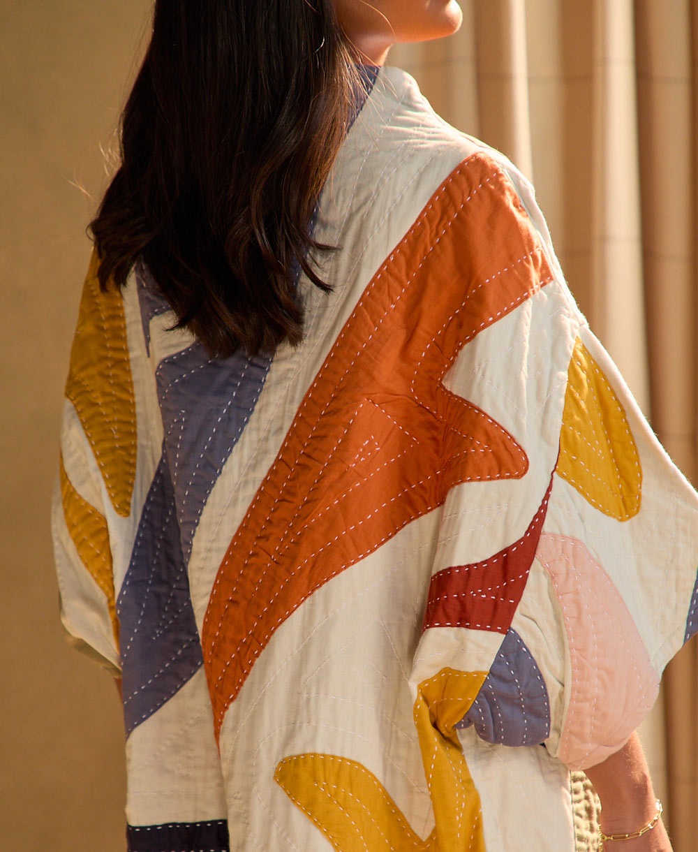 detail of petal cocoon quilted jacket and stitching
