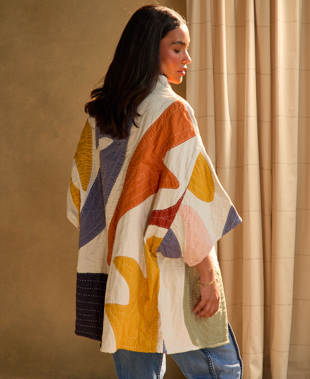 cocoon quilted jacket with colorful petal appliques made from 100% organic cotton