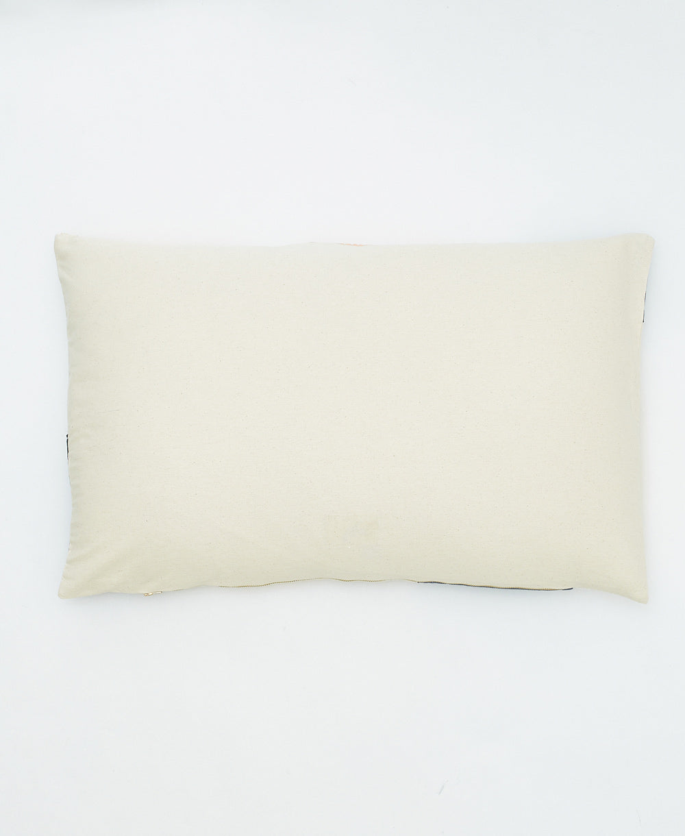 back of petal lumbar pillow in a solid natural white color