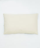 back of petal lumbar pillow in a solid natural white color