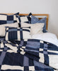 modern patchwork plaid quilt bedding with coordinating throw pillows