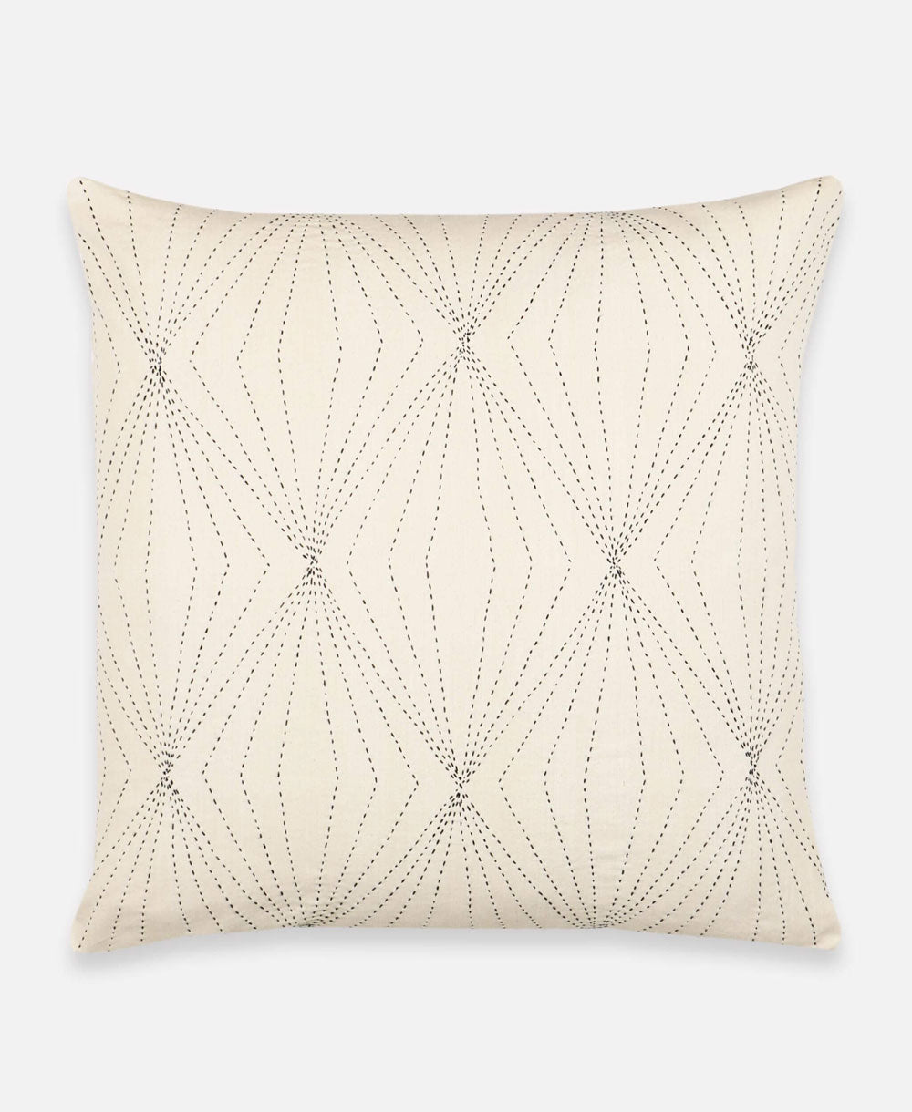 Decorative pillow with geometric bead pattern on a white background