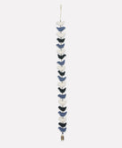 Decorative hanging with blue and white birds on a white background