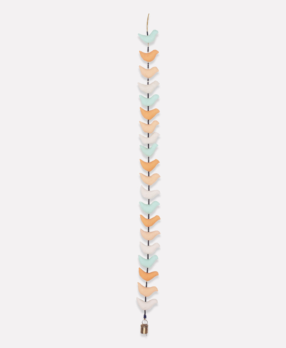 Decorative wall hanging with colorful heart-shaped stones on a white background