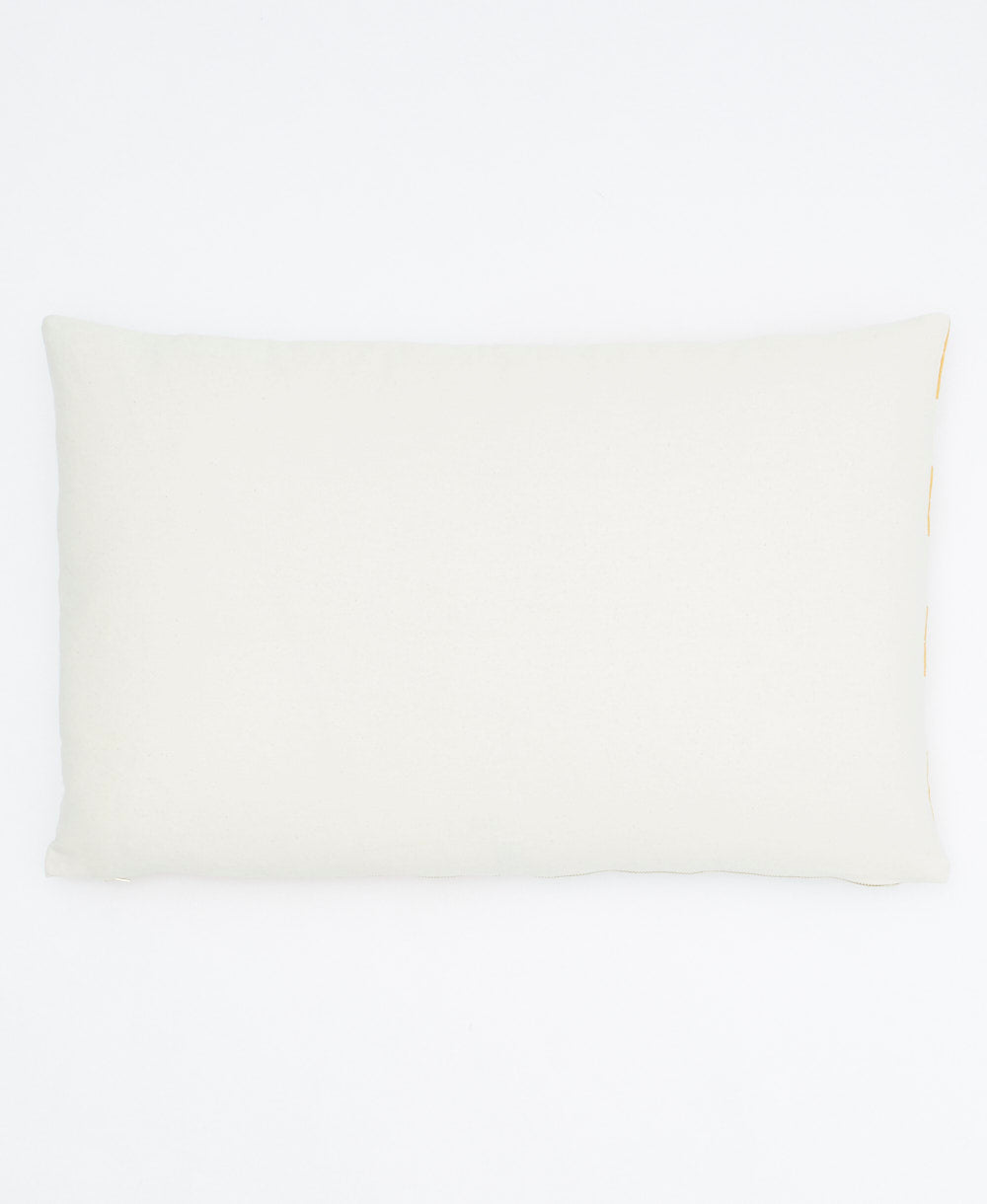 back of mustard yellow shift lumbar pillow in natural white