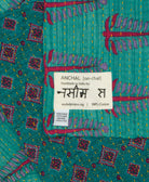small kantha blanket with signature of the maker on the tag