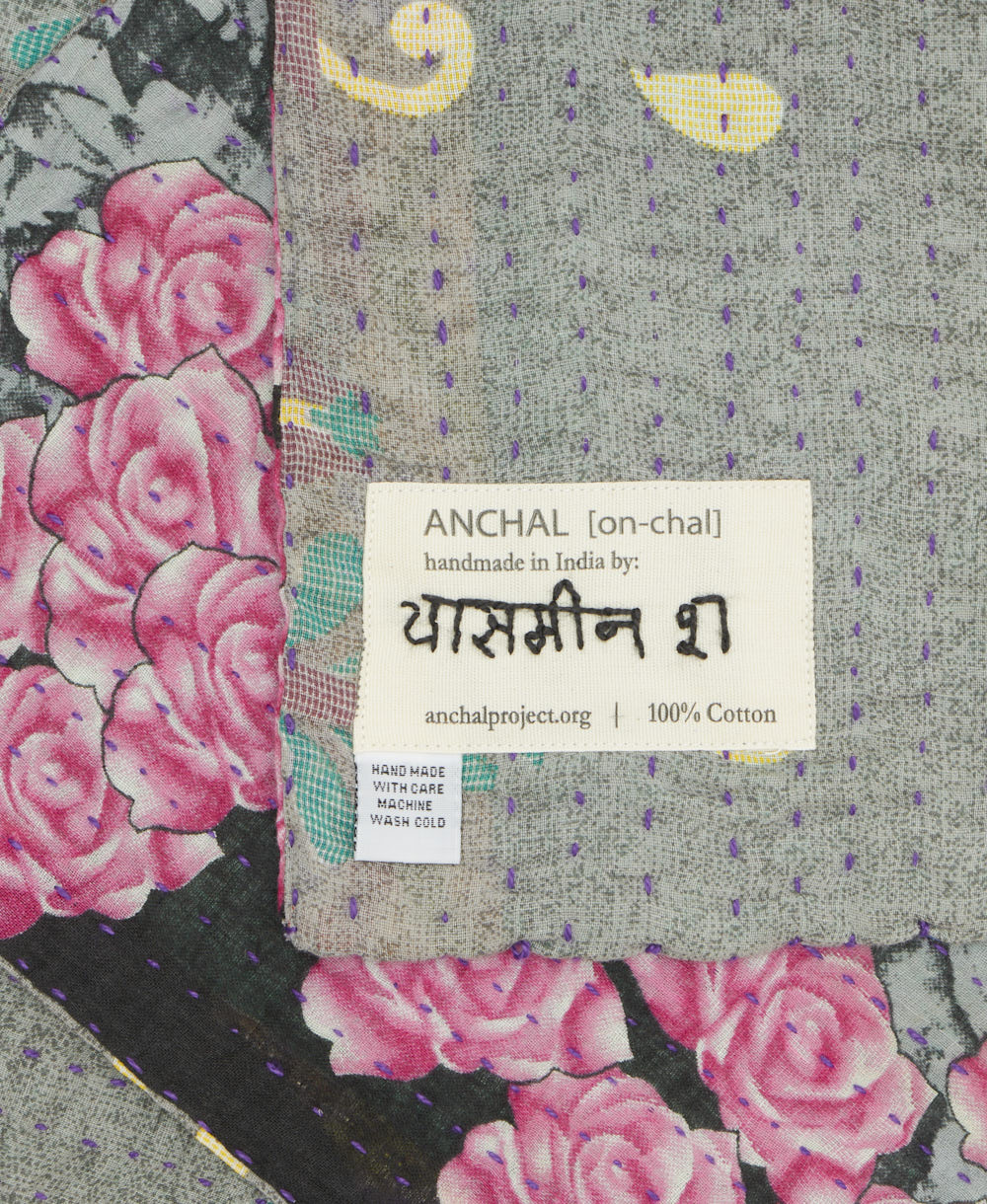 small kantha blanket with signature of the maker on the tag
