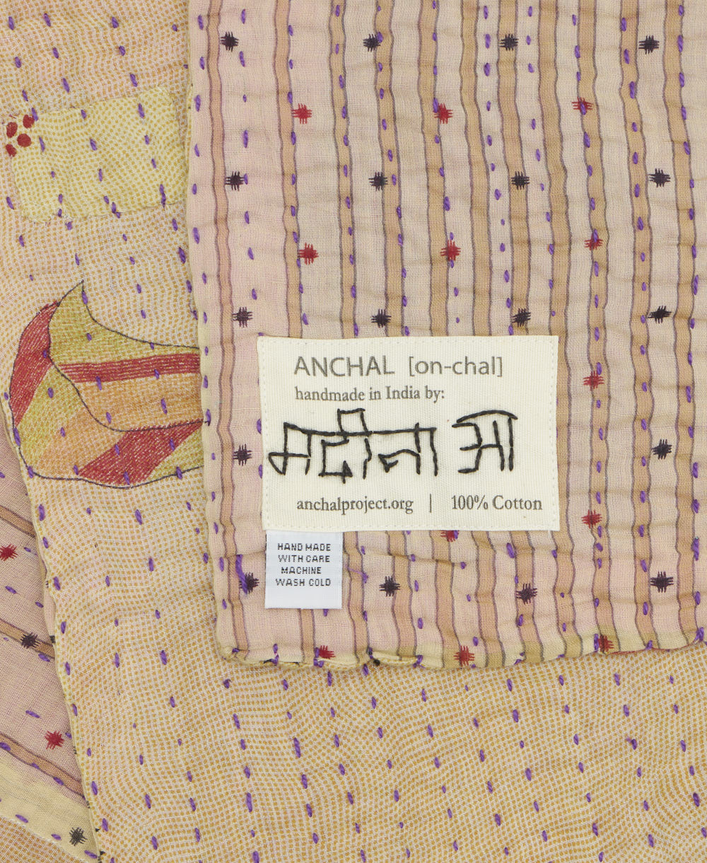small kantha blanket with signature of the maker on the tag