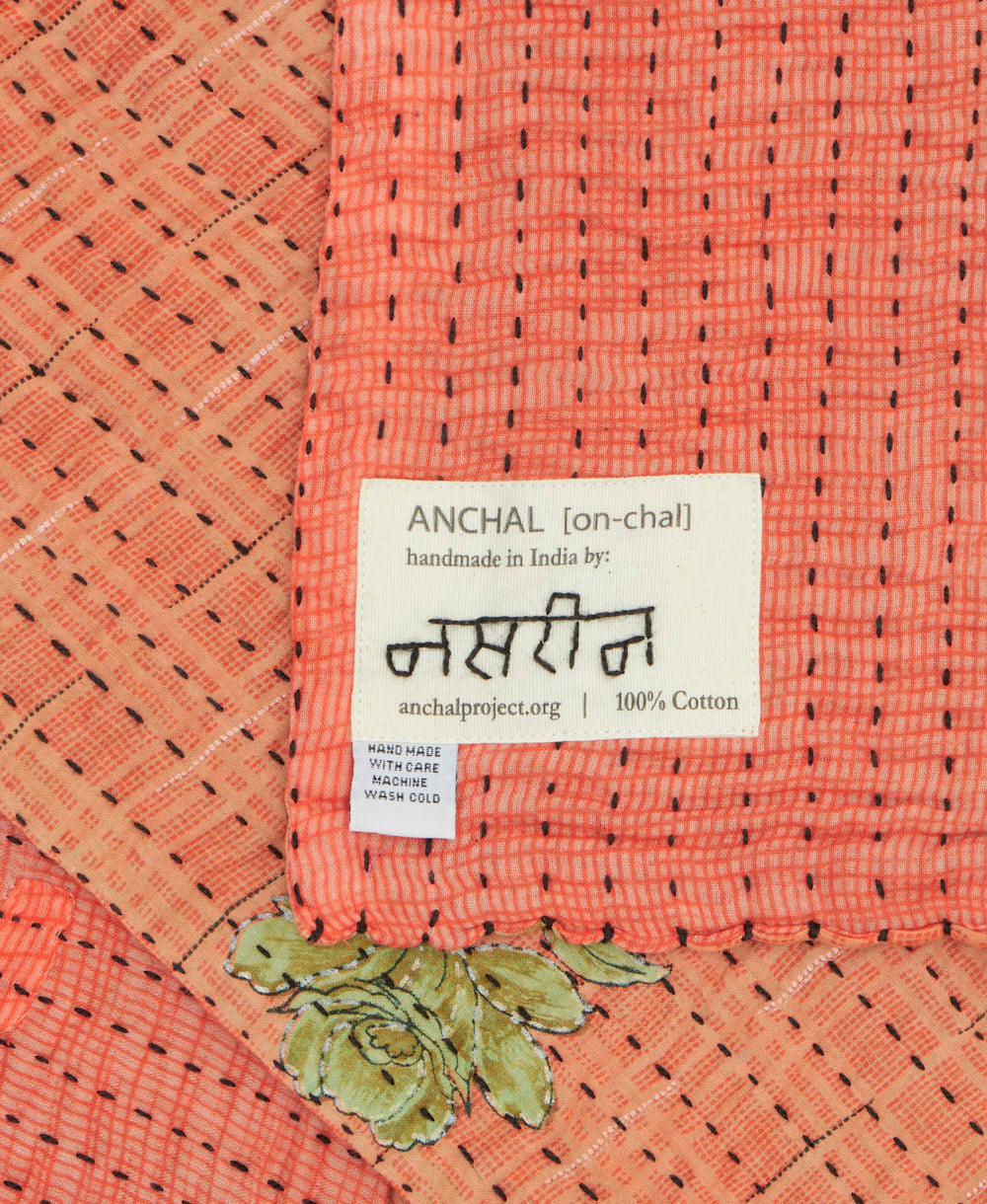 small kantha blanket with signature of the maker on the tag
