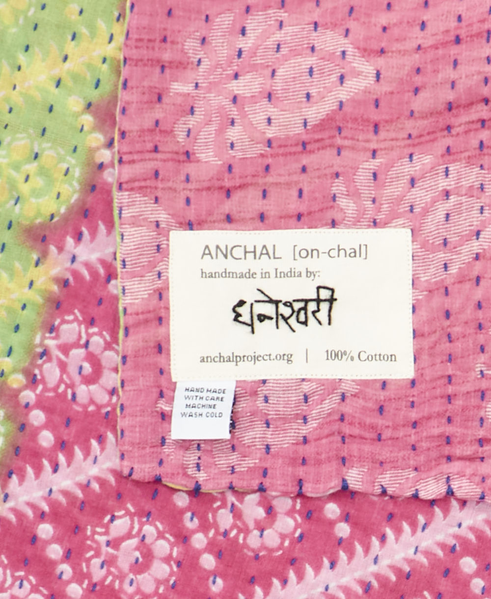 small kantha blanket with signature of the maker on the tag