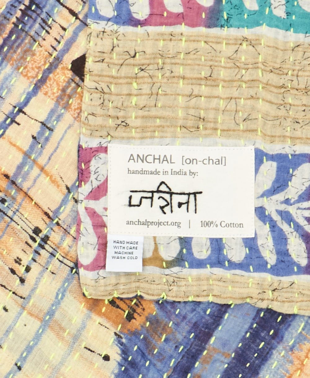 small kantha blanket with signature of the maker on the tag