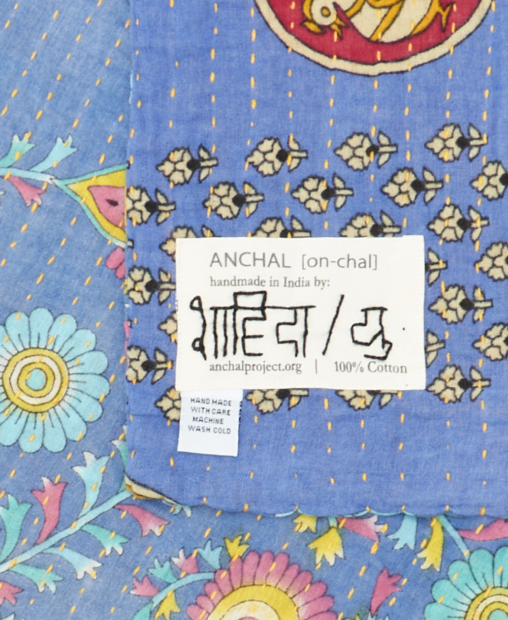 small kantha blanket with signature of the maker on the tag