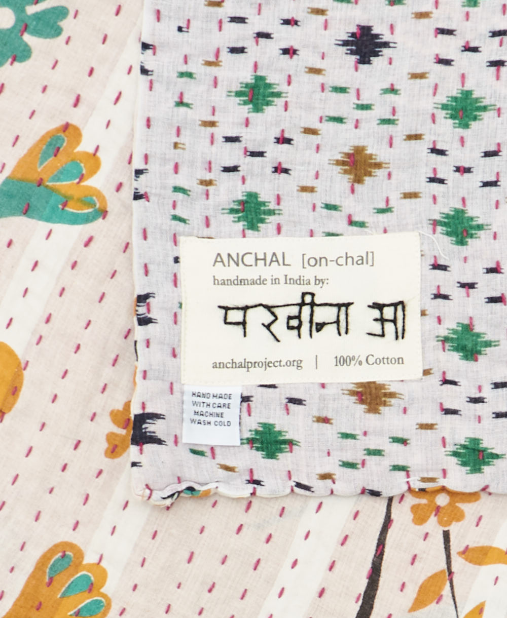 small kantha blanket with signature of the maker on the tag