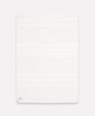 solid white back of slate blue triangle patchwork quilt throw