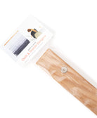 Wooden quilt hanger with a label on a white background