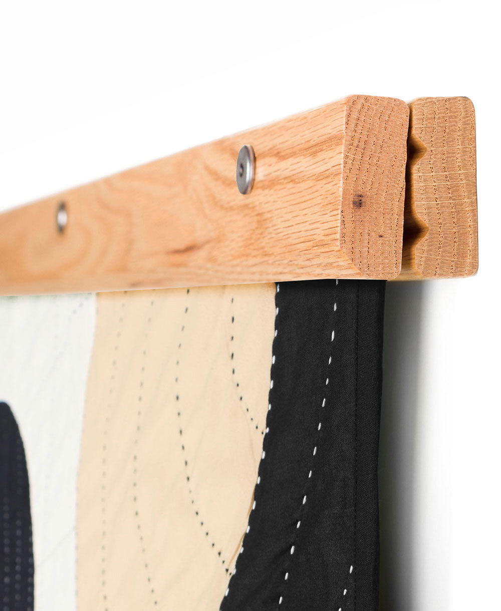 wooden textile hanger that does no damage to a quilt