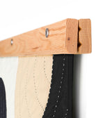 wooden textile hanger that does no damage to a quilt