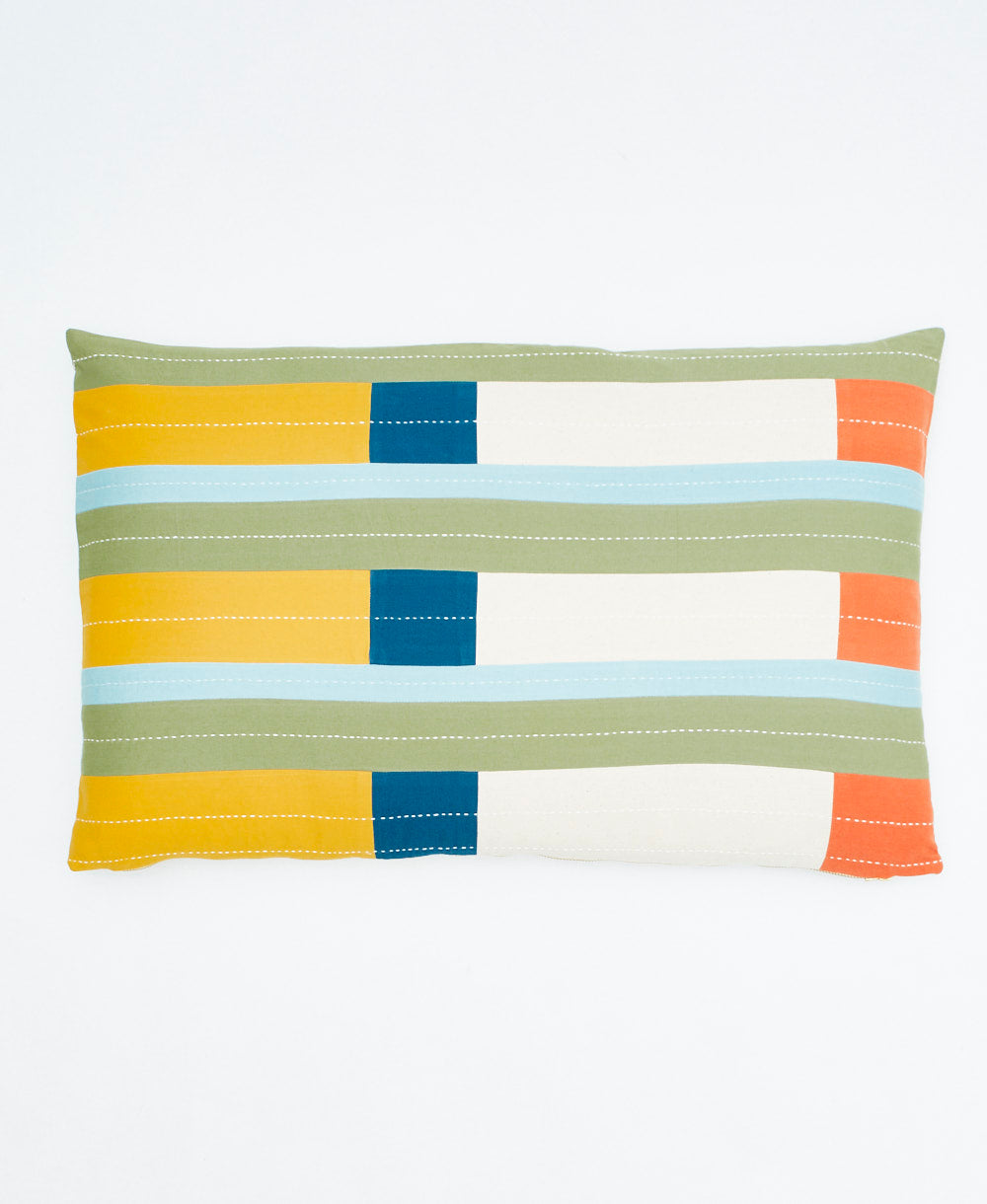 Colorful striped pillow with geometric pattern on a white background