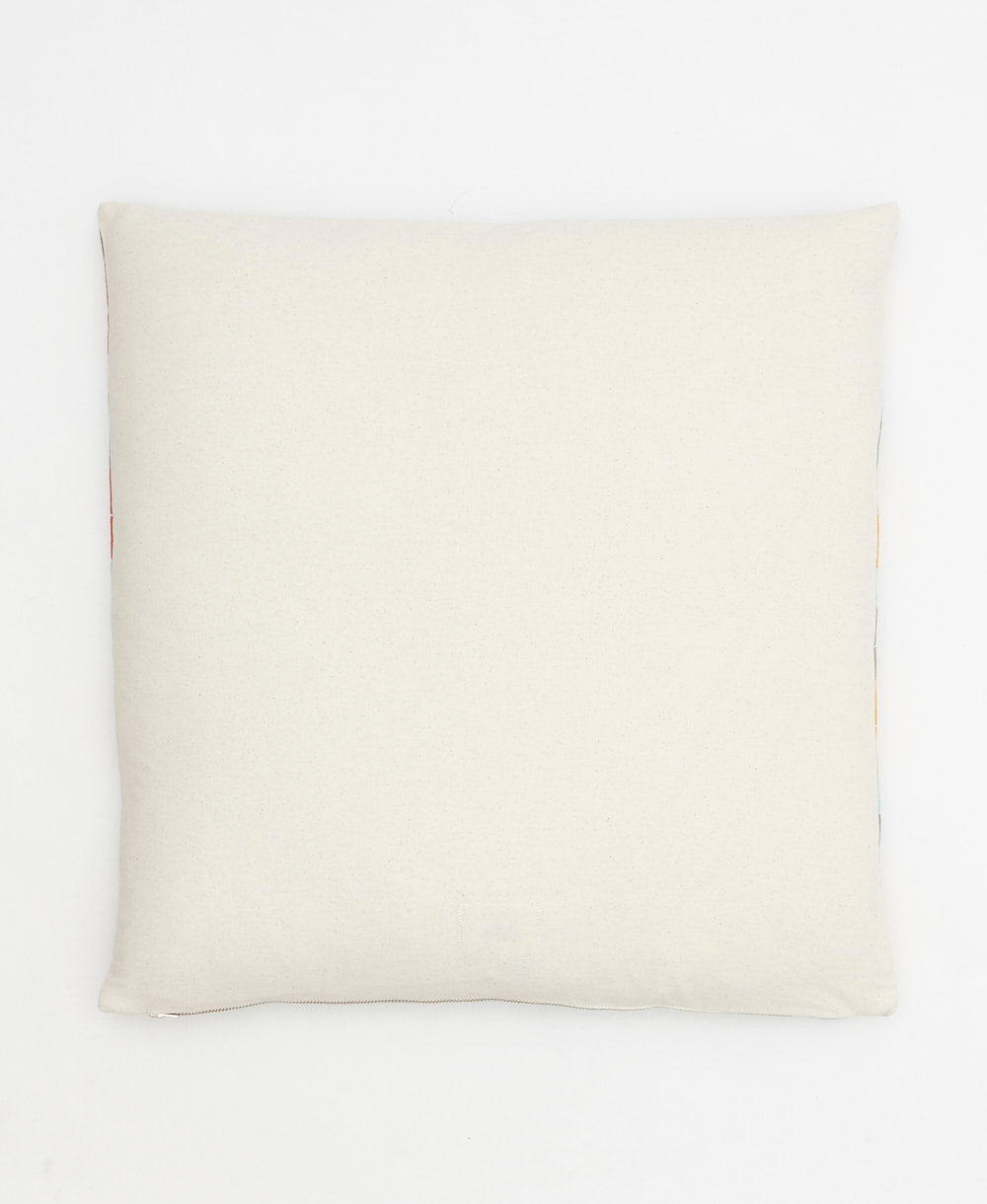 back of stamp throw pillow in natural white
