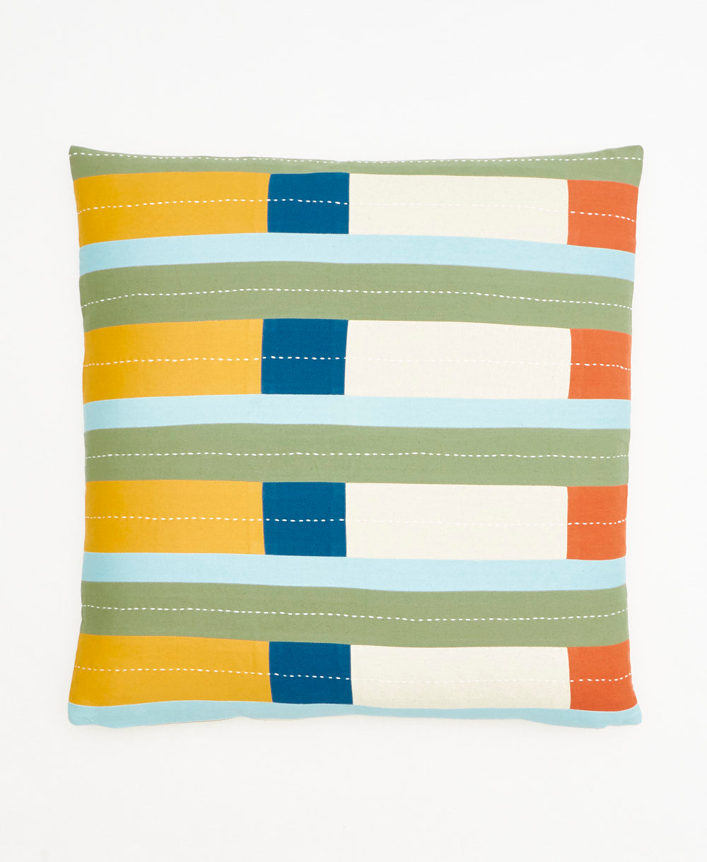 Colorful striped pillow with geometric pattern on a white background