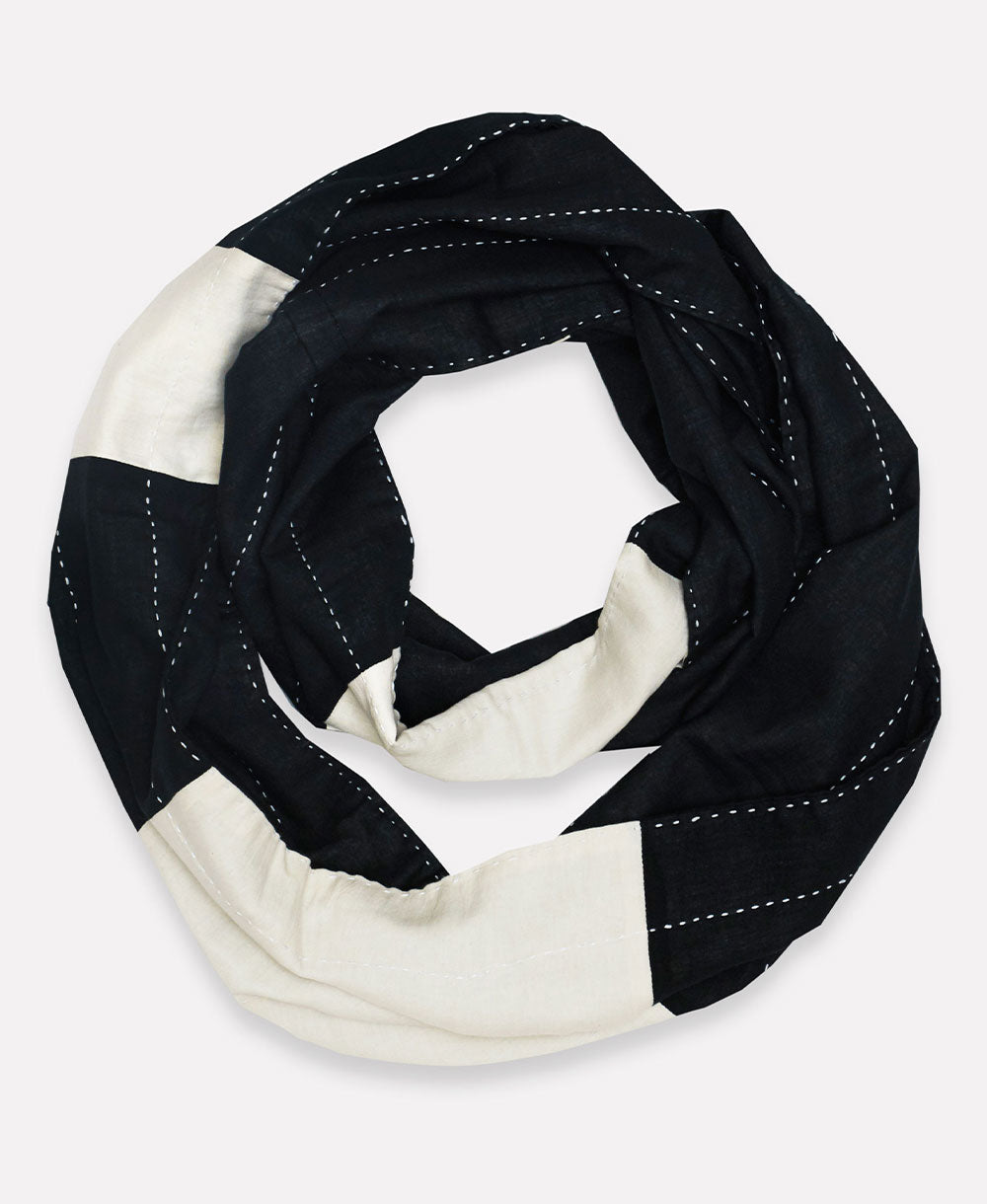 black and white circle scarf with white hand-stitched embroidery