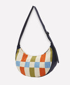 crescent bag in checkered print in navy blue, olive green, sky blue and orange