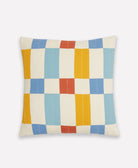Checkered throw pillow with multicolored squares on a white background