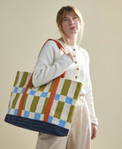 checkered canvas tote bag in blue, olive green, sky blue and orange