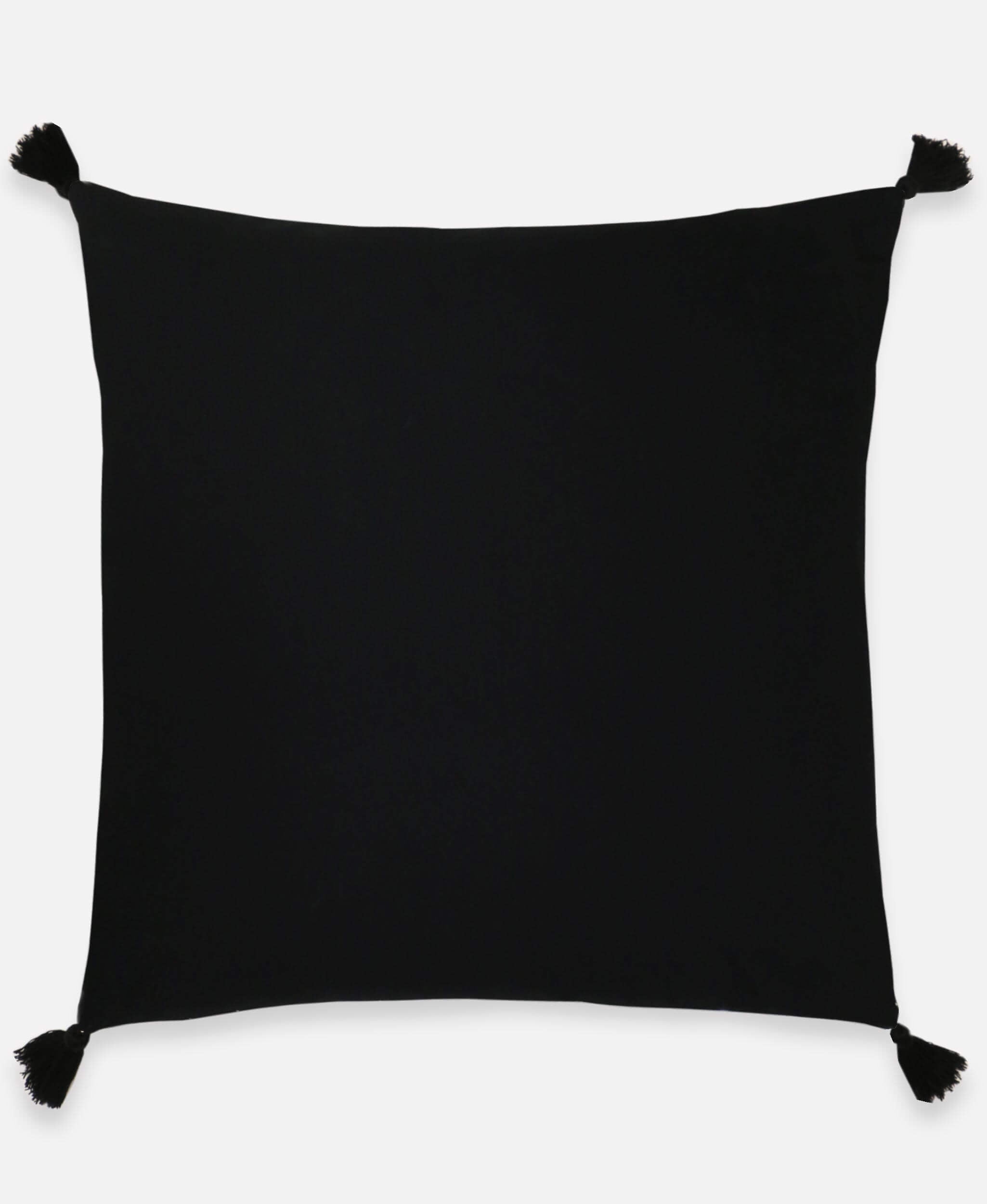 Black pillow with tassels on a white background