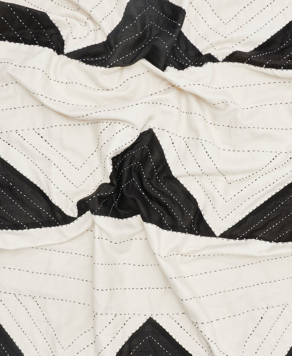 Close-up of a black and white quilted fabric pattern
