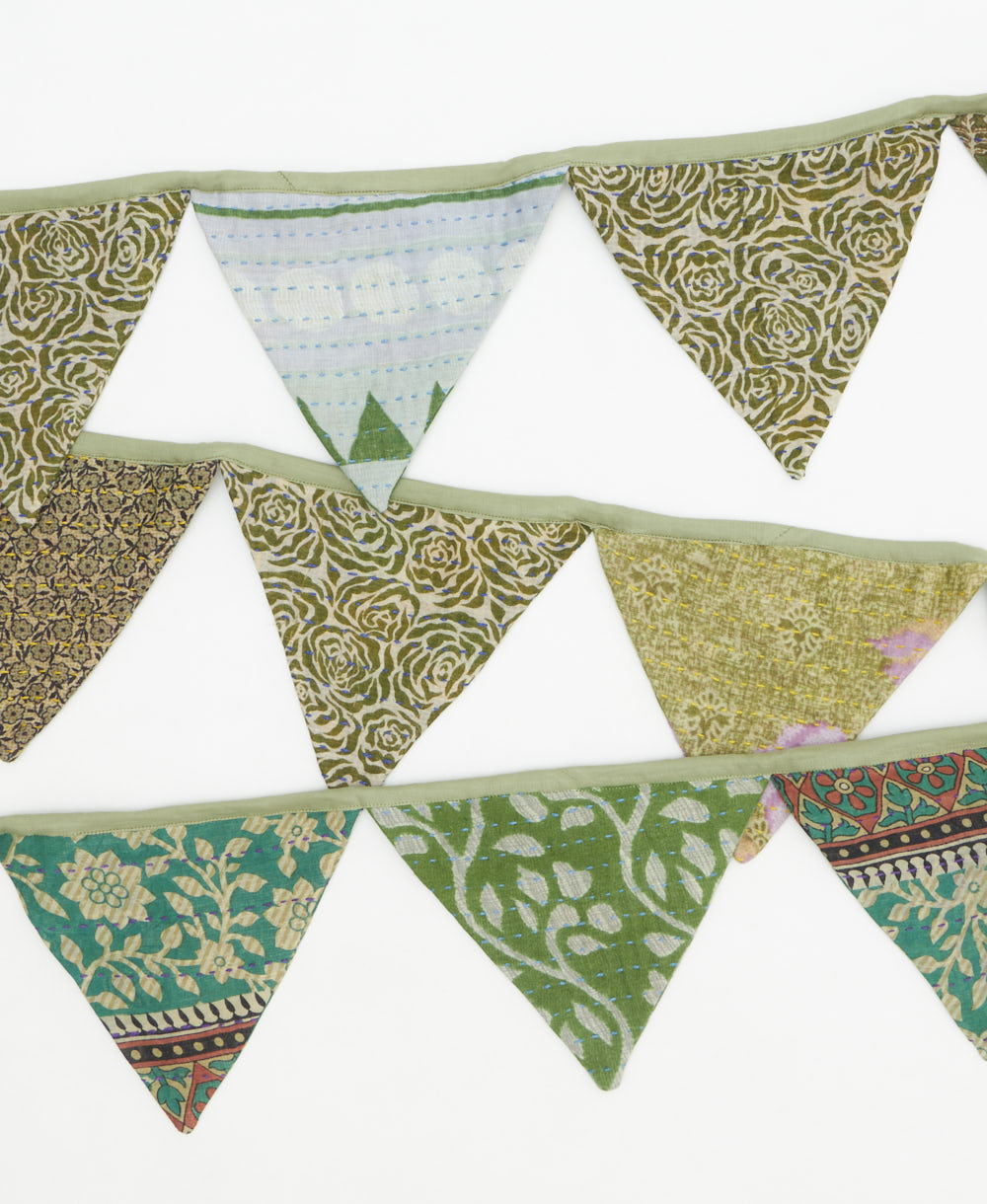 Set of colorful triangular fabric flags on a white background