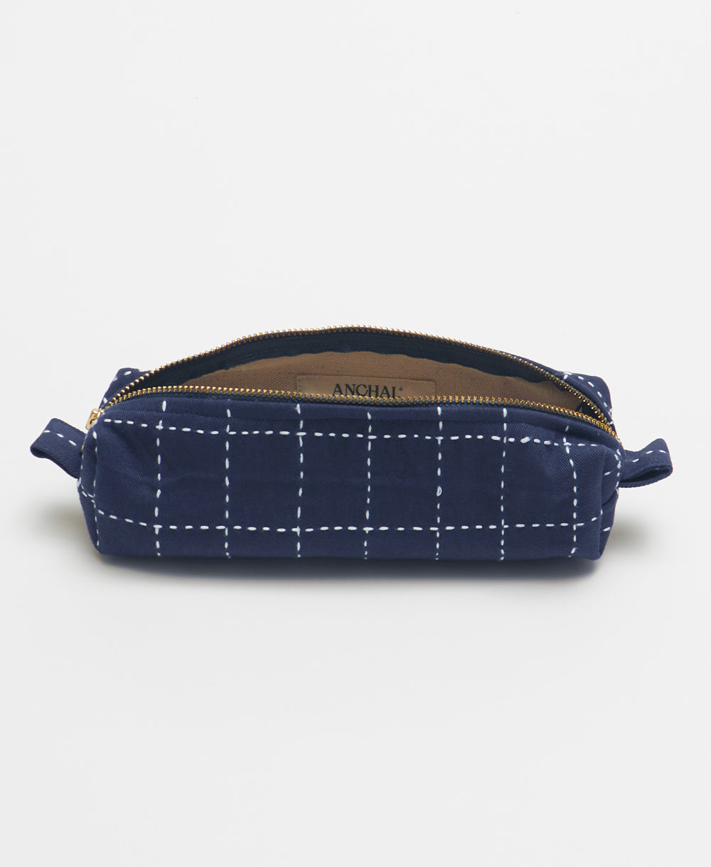 navy blue grid-stitch small toiletry bag with white stitching