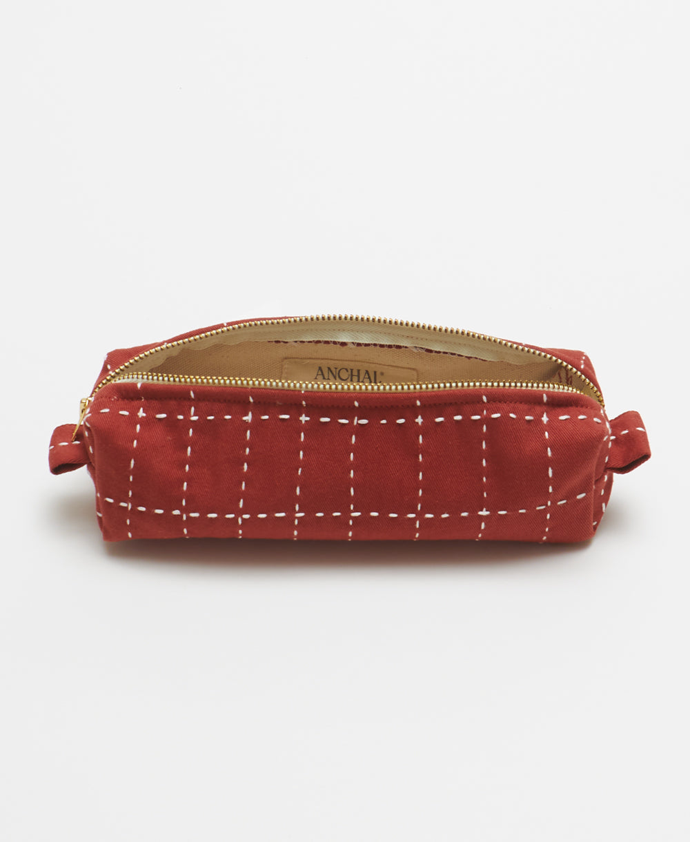 rust red toiletry bag in small size handmade in India by women artisans from organic cotton