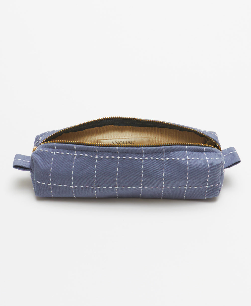 ethically made small toiletry bag in slate blue with white embroidery