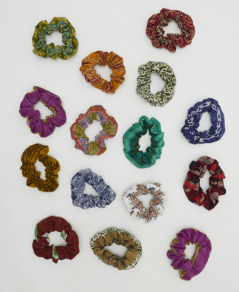 grouping of colorful vintage cotton scrunchies on white background
