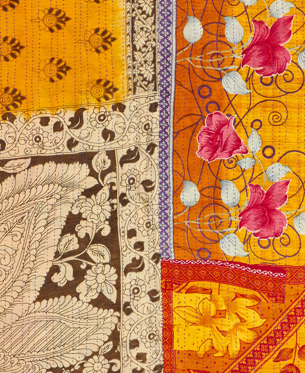 a golden yellow traditional  kantha bedding quilt ethically made from vintage cotton fabric
